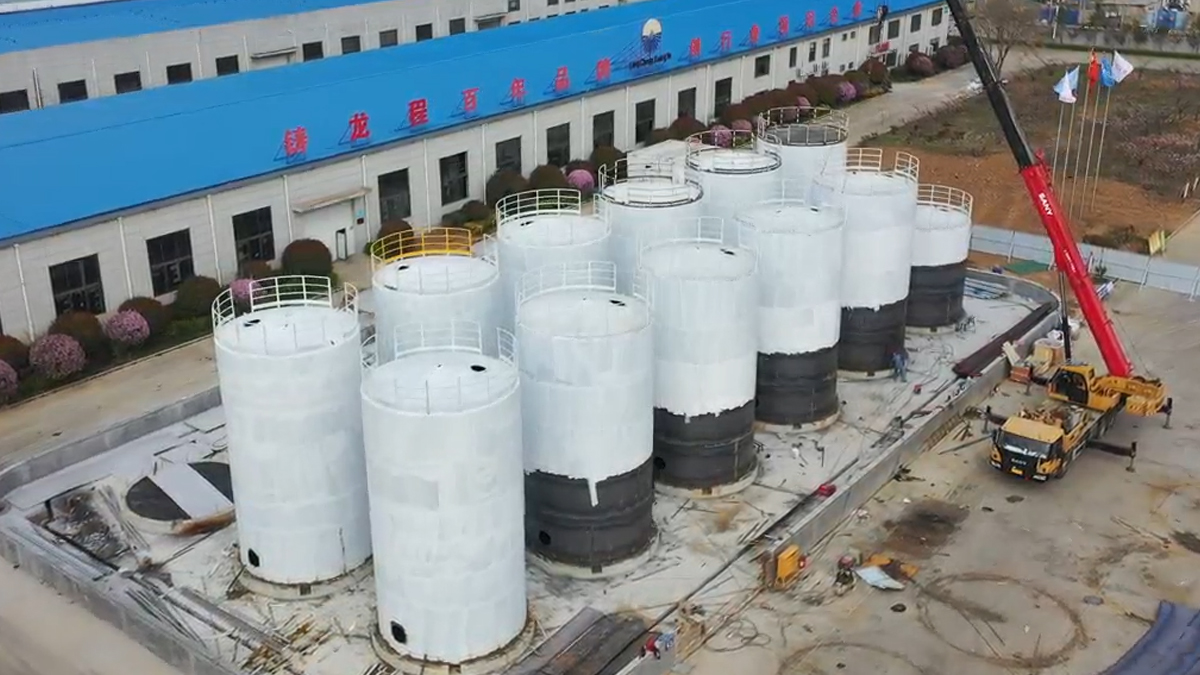 1 3 Cluster of large white vertical cylindrical storage tanks under construction at Shijie Heavy Industry facility