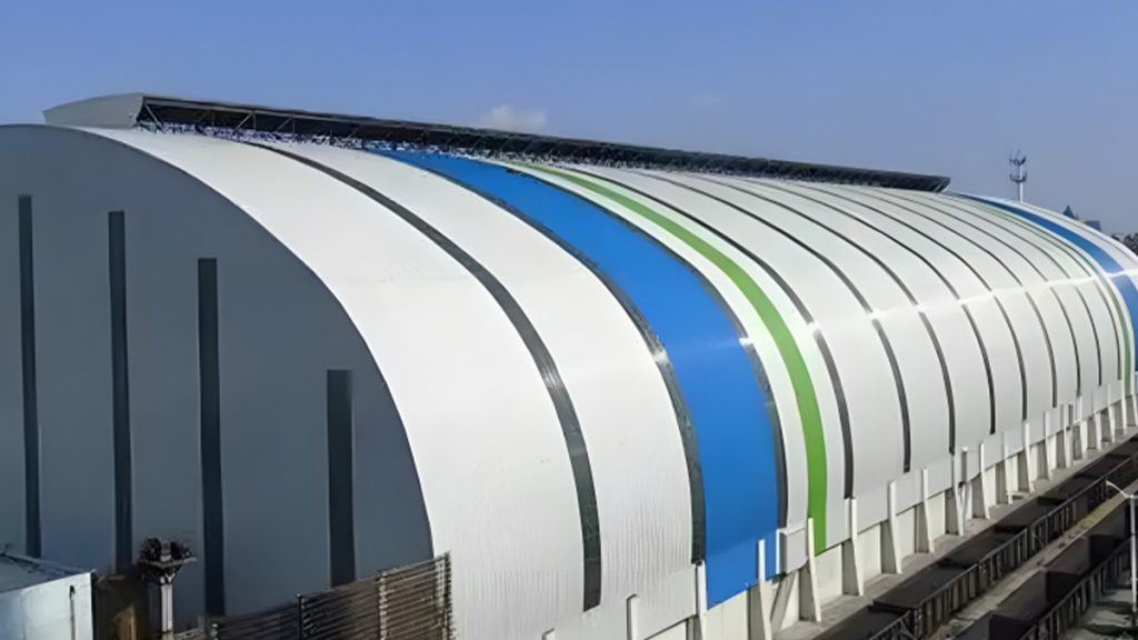 6 1 Modern large-span curved roof industrial steel building with white and blue exterior panels by Shijie Heavy Industry